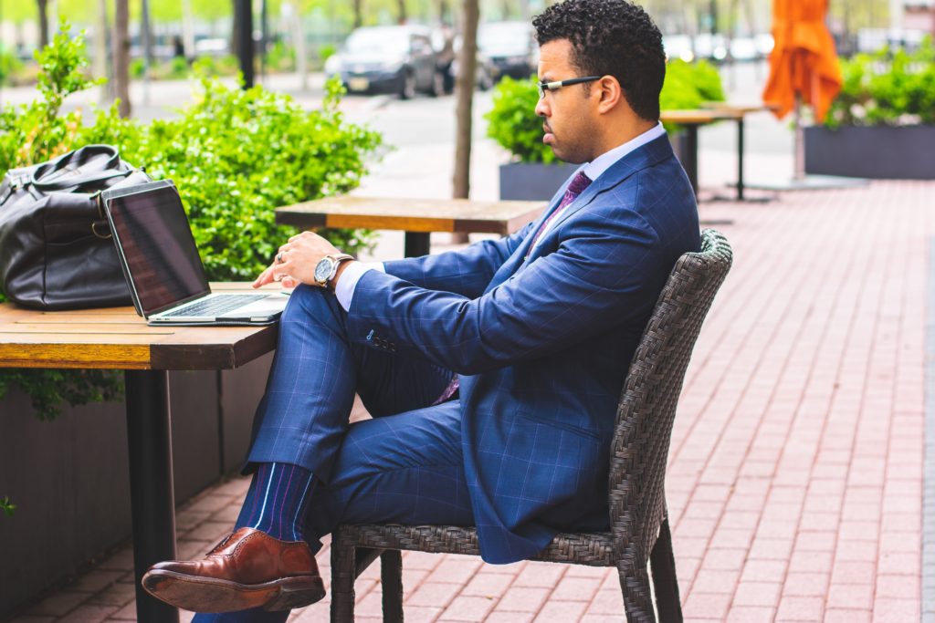 Business man siting in front of his computer