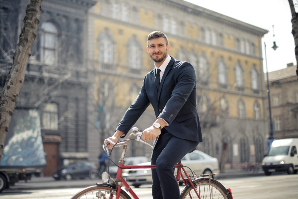 / Sabau Digital Lifestyle businessman riding a bicycle