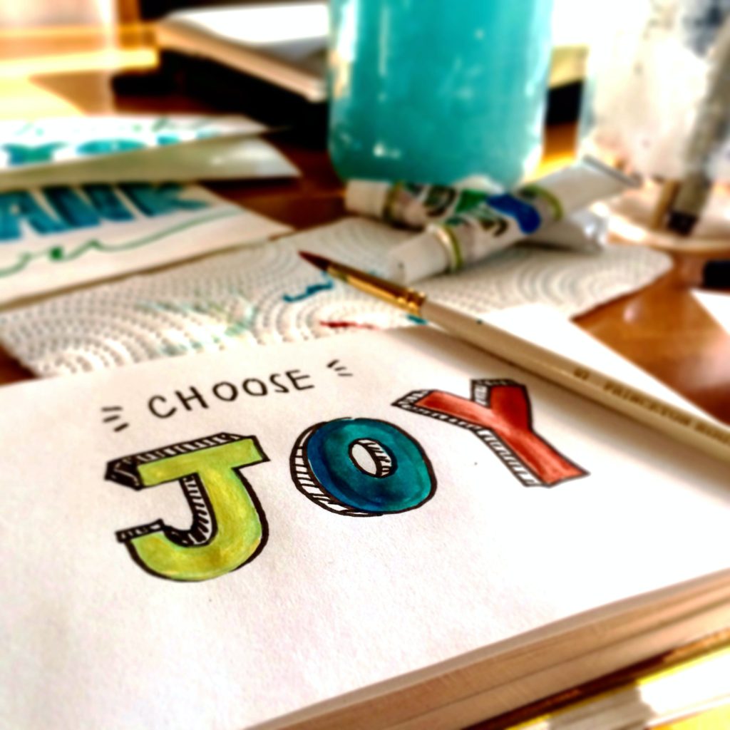 Choose joy painting with a brush